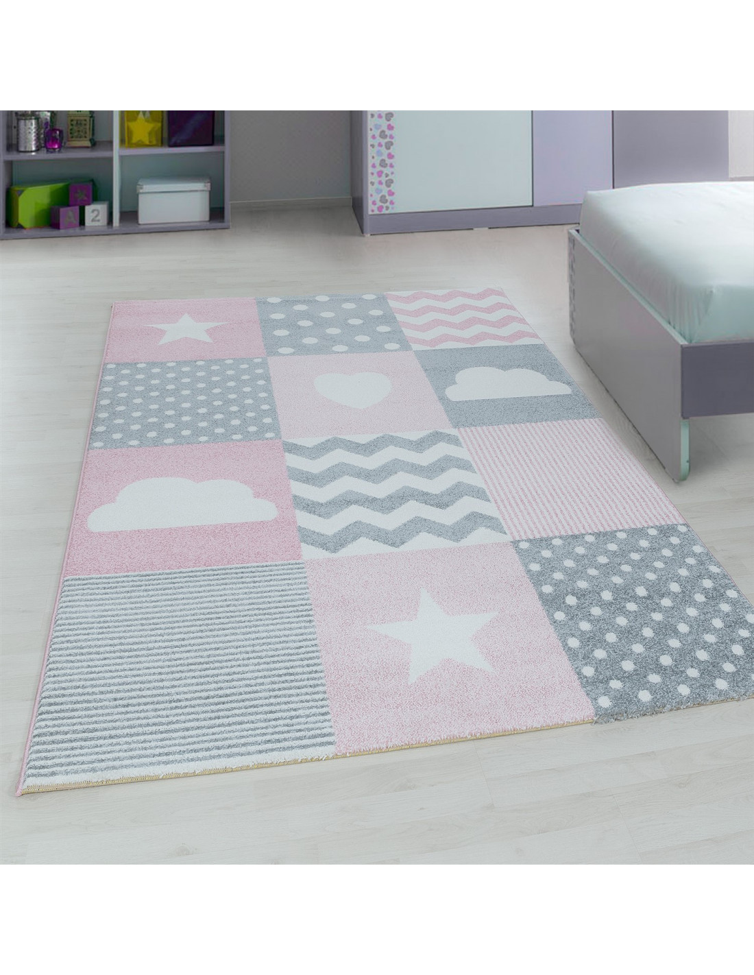 Designer children's room rug with pink motifs