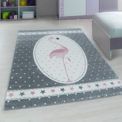 Children's room rug with flamingo pink motifs